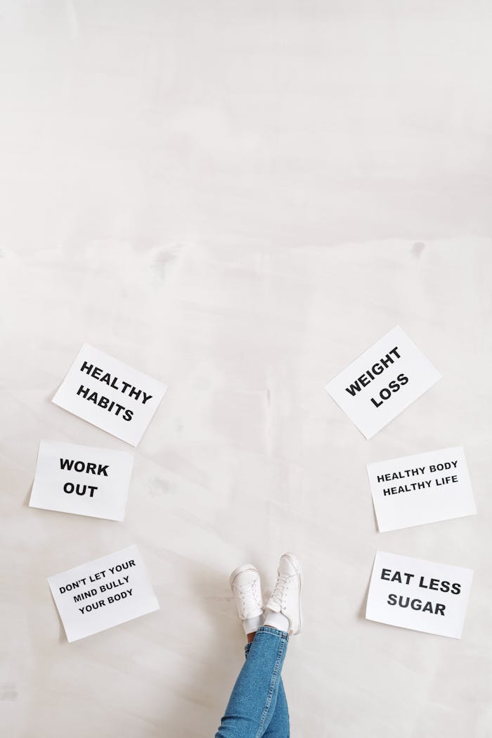 services-02 Overhead view of motivational boards inspiring healthy lifestyle with casual denim and sneakers.